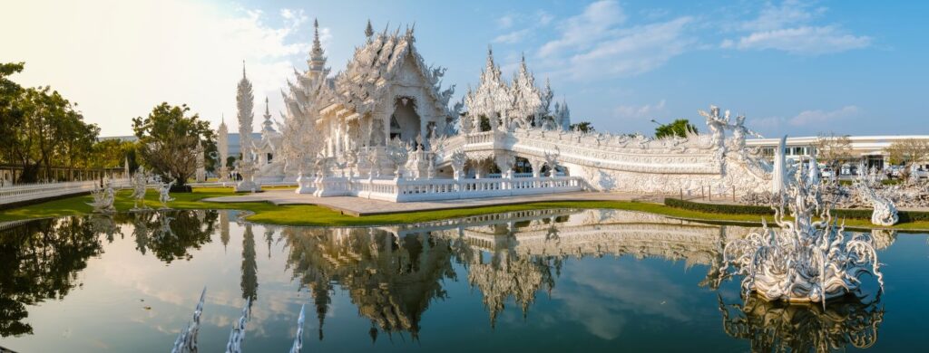 White Temple Chiang Rai Thailand With Reflection In The Water Wat Rong Khun Northern Thailand